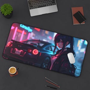 May include: A black and white anime-style illustration of a woman with long black hair and a white shirt. She is standing in front of a blue sports car with neon lights in the background. The image is on a black mousepad.