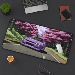 May include: Purple car driving on a road lined with pink cherry blossom trees. The car is a Japanese sports car with a large spoiler and a wide body. The background is a blue sky with white clouds.