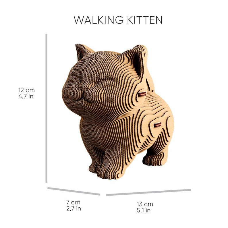 May include: A tan cardboard sculpture of a kitten labelled WALKING KITTEN. The figure is constructed from layered corrugated material. Dimensions are 12 cm (4.7 in) in height, 7 cm (2.7 in) in width, and 13 cm (5.1 in) in length.