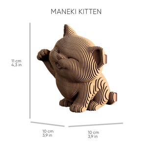 May include: A Maneki Kitten figurine constructed from layered tan corrugated cardboard. The cat is in a seated position with one paw raised. Dimensions are 11 cm in height, 10 cm in width, and 10 cm in depth as indicated by the text in the image.