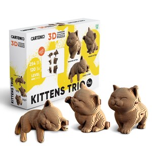 May include: A 3D cardboard sculpture puzzle set titled Kittens Trio, featuring three assembled kitten figures in different poses. The white and yellow box displays the text Cartonic 3D Cardboard Sculpture Puzzle, 254 pieces, and 120 level.