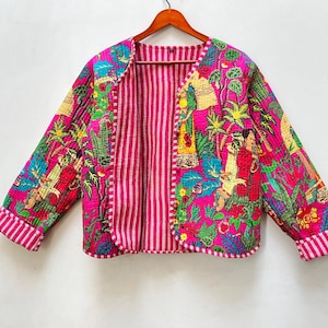 May include: A pink quilted jacket with a floral print and striped lining. The jacket has a relaxed fit and long sleeves.