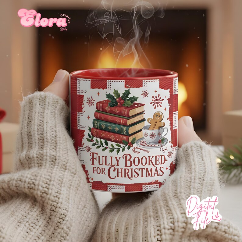 May include: A red and white Christmas-themed mug with the text "Fully Booked for Christmas." The mug features a stack of books, snowflakes, and a gingerbread man in a teacup. The mug is held by someone wearing a beige sweater.