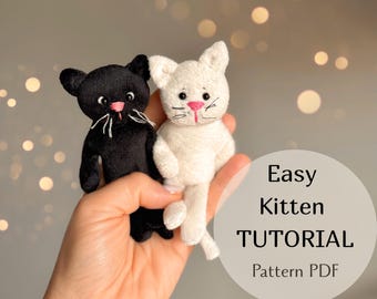 May include: Two plush kitten toys, one black and one white, with pink noses and embroidered whiskers. The image includes the text "Easy Kitten TUTORIAL Pattern PDF" in a circular graphic.