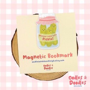 a magnetic bookmark with a playful design of a jar of pickles and a caption that reads "Whatever tickles your Pickle!"