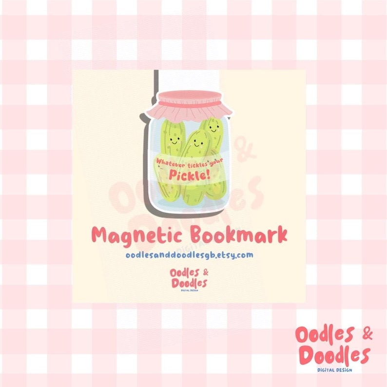 A hand holding a magnetic bookmark of a pink and green jar of pickles with a label saying "Whatever tickles your pickle!" on a square backing card.