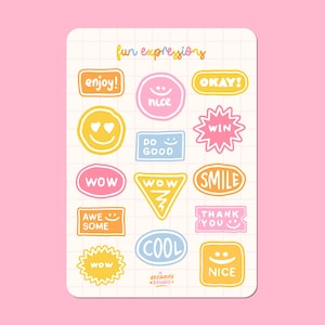 May include: A sheet of stickers with various colorful and fun expressions, including "enjoy!" "okay!" "nice" "win" "wow" "smile" "awesome" "thank you" "cool" and "nice".