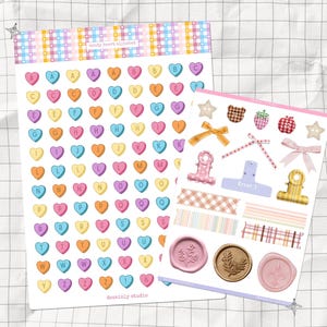 May include: Two sticker sheets with a pastel theme. One sheet features candy heart stickers with letters. The other sheet has various stickers, including bows, stars, and wax seals. The text "candy heart stickers" is at the top.