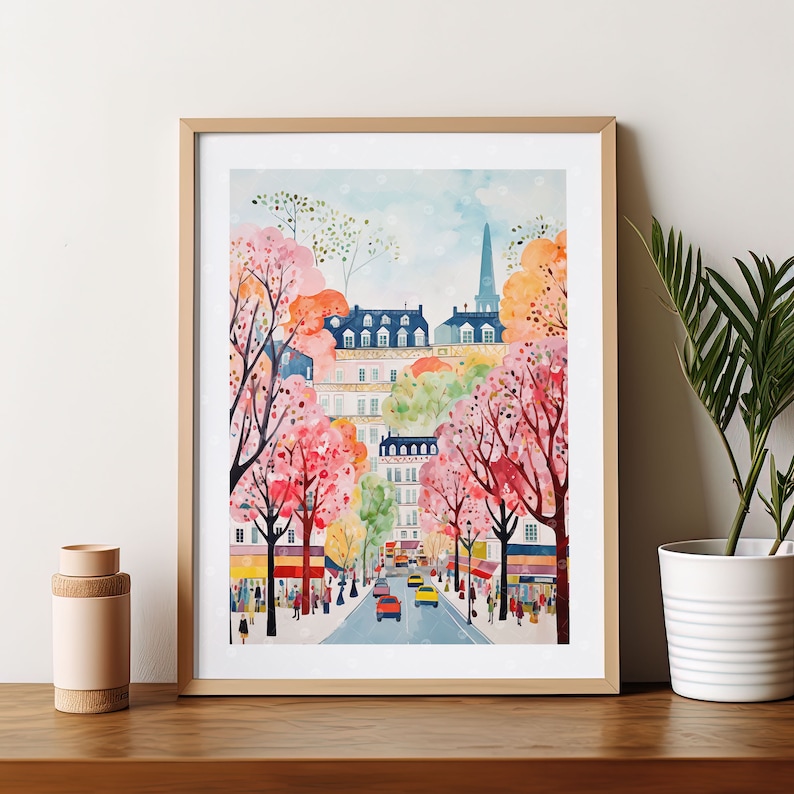 May include: A watercolor painting of a Parisian street scene with colorful buildings and blooming trees. The street is lined with trees in full bloom, with pink and white flowers. Cars are driving down the street, and people are walking on the sidewalk. The painting is framed in a light wood frame.
