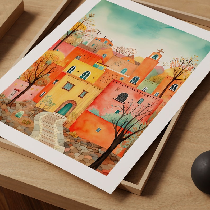 May include: A watercolor painting of a colorful village with orange, yellow, and green buildings. The buildings are clustered together and have a whimsical, fairytale-like quality. There are trees and a path leading up to the village.