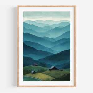 May include: A framed art print featuring a watercolor landscape of layered blue mountains. Small buildings are nestled on green hills in the foreground. The artwork has a serene, natural theme.