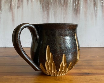 Black handmade carved ceramic mug, wheel-thrown pottery