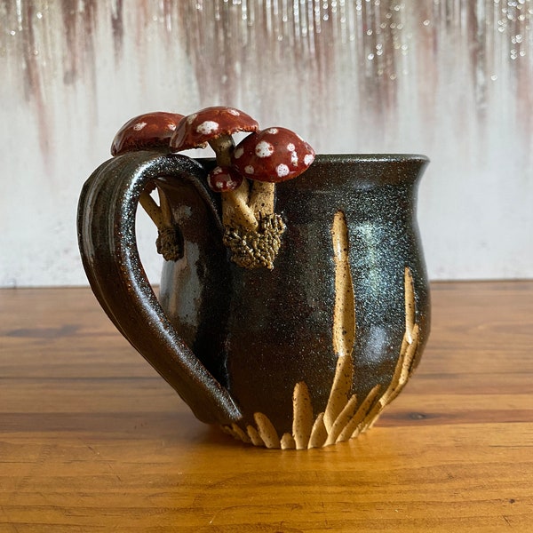 Black handmade mushroom carved ceramic mug, wheel-thrown pottery