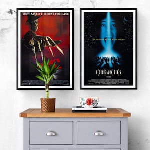 Two movie posters framed in black. The poster on the left features Freddy Krueger from the movie "A Nightmare on Elm Street" with the text "They saved the best for last." The poster on the right features the movie "Screamers" with the text "The last person you hear will be you own."
