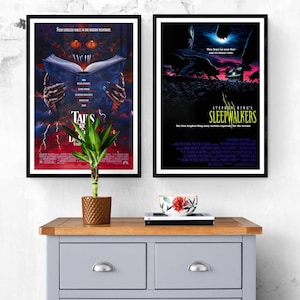 Two movie posters, one for the film "Tales from the Darkside: The Movie" and the other for "Stephen King's Sleepwalkers". Both posters feature dark, horror-themed imagery.