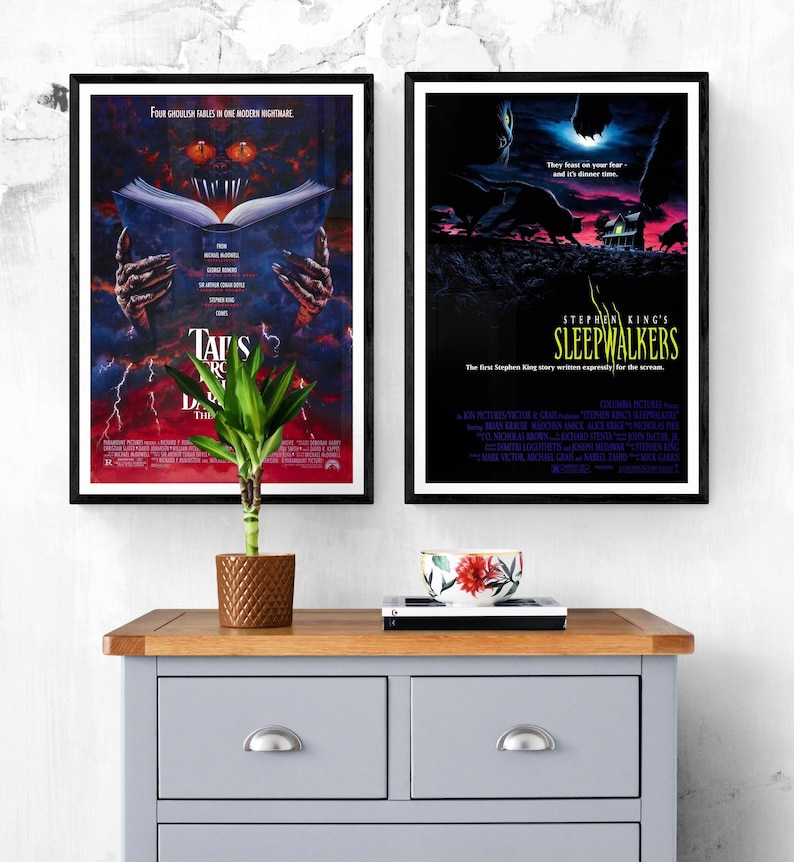 Two movie posters, one for the film "Tales from the Darkside: The Movie" and the other for "Stephen King's Sleepwalkers". Both posters feature dark, horror-themed imagery.