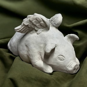 Flying pig with wings figure Concrete laying pig statue Detailed stone made sculpture