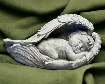 Concrete baby with wings statue Sleeping cherub porch figure Detailed angel in wings decorations Cute religious sculpture