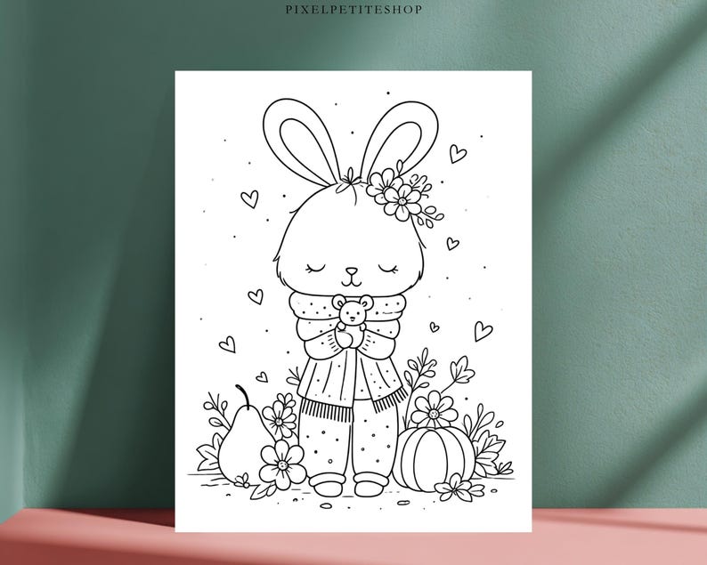 May include: A black and white line art coloring page featuring a rabbit with long ears, wearing a scarf and holding a small teddy bear. The rabbit is surrounded by flowers, a pear, a pumpkin, and floating hearts. The text PIXELPETITESHOP is at the top.
