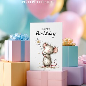 May include: A birthday greeting card featuring a watercolor illustration of a mouse holding a sparkler. The card reads "Happy Birthday" in elegant script. The card is surrounded by pastel-colored gift boxes and balloons, creating a festive atmosphere.