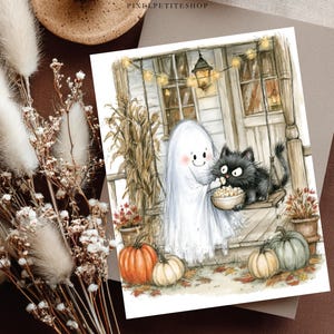 May include: A rectangular art print featuring a watercolor illustration of a white ghost and a fluffy black cat sitting on a porch swing eating popcorn. The scene includes orange and green pumpkins, dried corn stalks, and string lights.