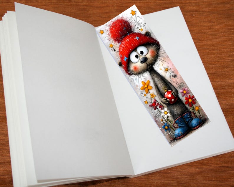 May include: A colourful bookmark depicting a cartoon cat in a red hat and blue boots, holding a polka-dot bauble. The cat is surrounded by flowers. The bookmark is placed in an open book, with the pages visible.