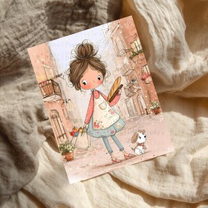 May include: A rectangular art print featuring a cartoon illustration of a person with a high bun hairstyle, wearing a floral apron over a pink shirt and blue pants. The person holds a baguette and a shopping bag, accompanied by a small white dog.