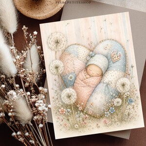 May include: A rectangular print featuring a watercolor illustration of a swaddled infant sleeping inside a large, heart-shaped patchwork pillow. The scene includes dandelion seed heads and small wildflowers in soft pastel blue, pink, and cream tones.