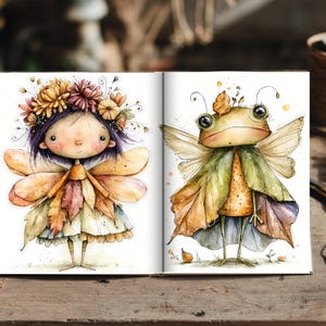 May include: An open book displaying two watercolor illustrations. The left page shows a fairy with purple hair, a floral crown, and leaf-patterned clothing. The right page features a frog with large eyes, wings, and a green leaf-like cloak.