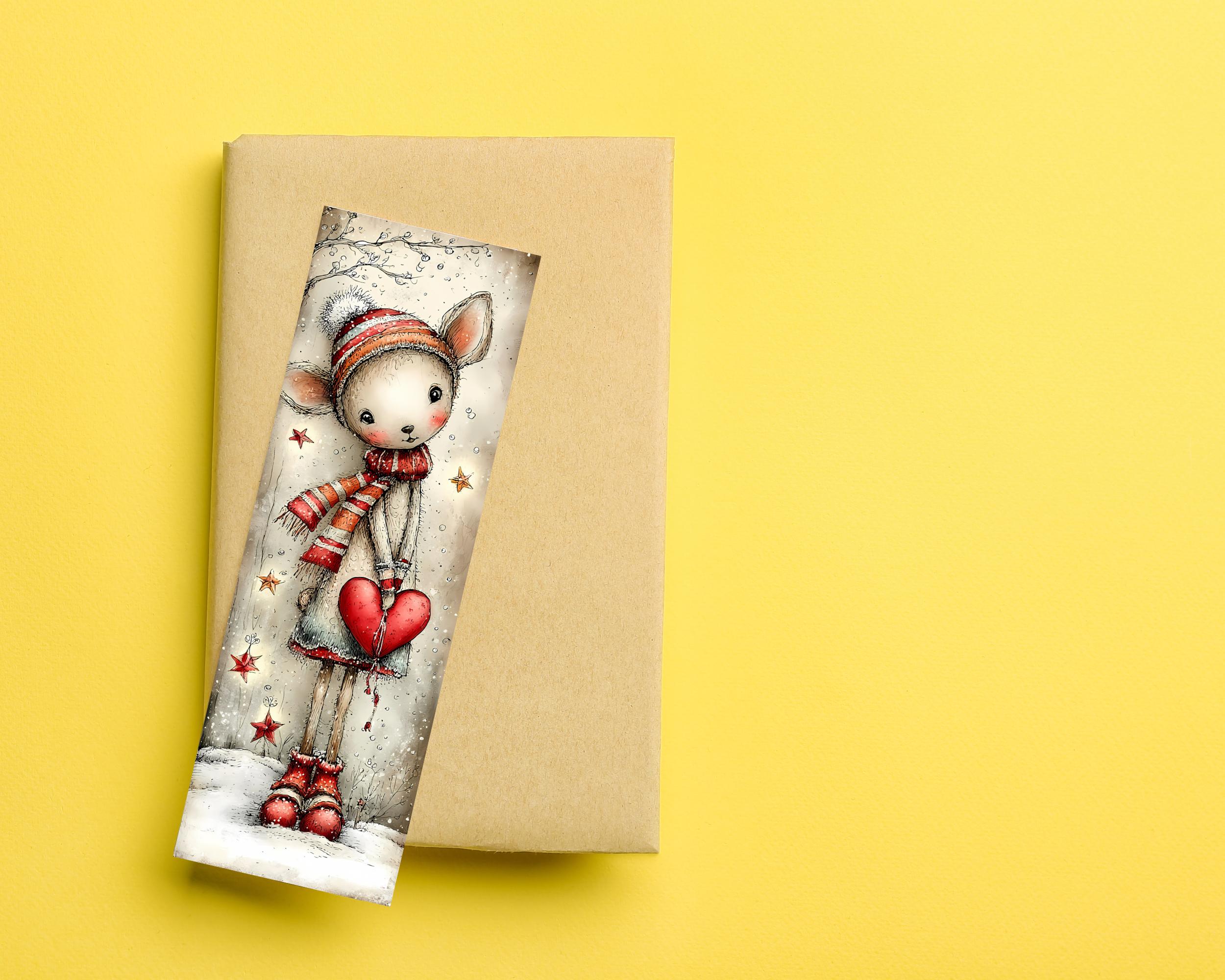 May include: A whimsical bookmark featuring a deer-like character in winter attire, holding a red heart. The character wears a striped hat and scarf, with red boots. The bookmark is set against a neutral background, with a yellow backdrop.