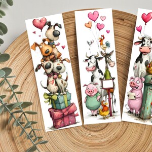 May include: Three whimsical bookmarks featuring cartoon animals. One shows a stack of dogs with heart balloons, another has a cow, pig, and rooster, and the last has a cow, pig, and rooster. Each bookmark has a white background and colorful illustrations.