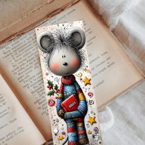May include: A charming bookmark depicting a cartoon mouse in a colourful sweater, holding a red book. The design includes stars, holly, and candy cane motifs. The bookmark is set against the backdrop of an open, vintage book.
