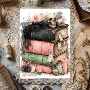 May include: A stack of four vintage-style books in black, pink, and green, topped with a human skull and black lace. The arrangement includes a pink candle, a small glass bottle, additional miniature skulls, and floral accents on a white background.