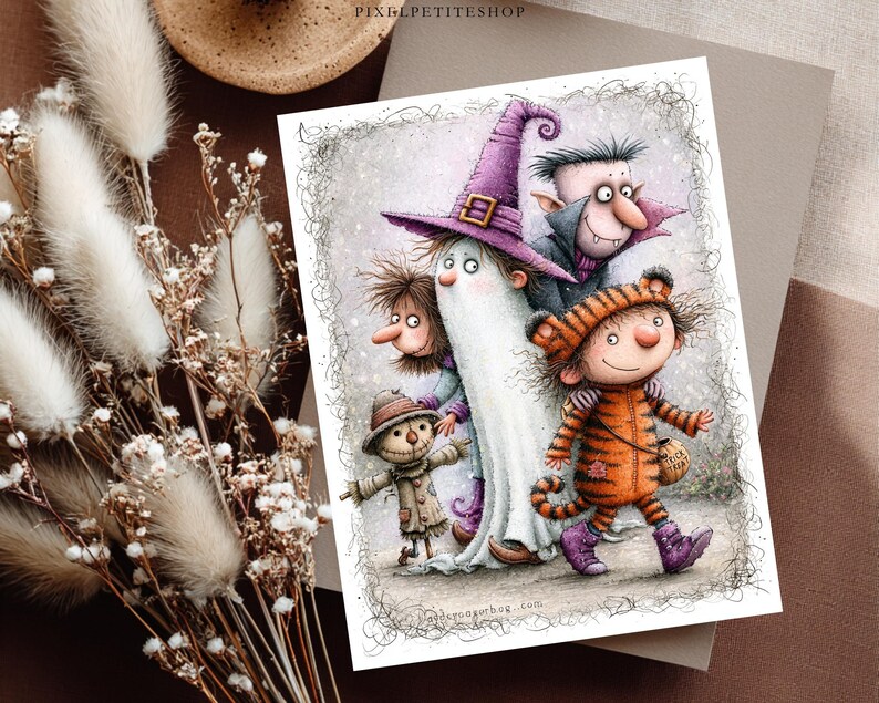 May include: A rectangular art print featuring a whimsical illustration of four characters in Halloween costumes: a scarecrow, a ghost in a purple hat, a vampire, and a child in a tiger suit holding a trick-or-treat bag, all set against a sketch-like background.