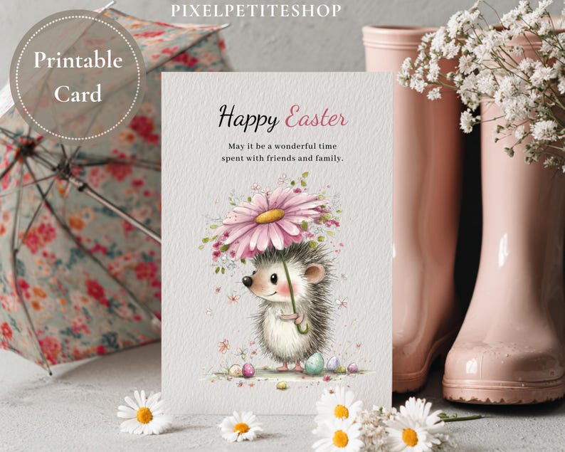 May include: A printable Easter card featuring a watercolor illustration of a hedgehog holding a daisy umbrella. The card reads "Happy Easter" with a message about spending time with friends and family. Pink rain boots and a floral umbrella are in the background.