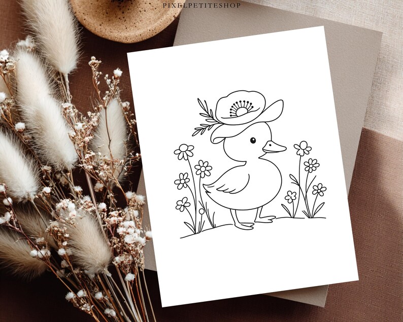 May include: A black and white line art drawing on a rectangular card featuring a small duckling wearing a large flower as a hat, standing among several simple daisies. The text PIXELPETITESHOP is printed in small black letters at the top centre.