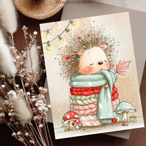 May include: A rectangular art print featuring a watercolor illustration of a hedgehog with spiky hair decorated with colorful lights, wrapped in a thick, multi-colored knitted scarf, holding a pink leaf, with mushrooms at its base.