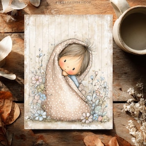 May include: A rectangular art print featuring a whimsical illustration of a child wrapped in a beige polka-dot blanket. The child has brown hair and rosy cheeks, surrounded by small blue, pink, and white flowers. The text PIXELPETITESHOP is visible.