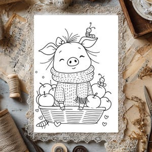 May include: A black and white line art illustration featuring a cartoon pig wearing a scarf and sweater, sitting in a basket filled with apples. A small caterpillar rests on the pig's head, and another sits on an apple. Small hearts surround the basket.