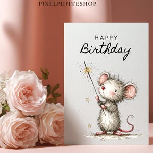 May include: A birthday card featuring a watercolor illustration of a cute mouse holding a sparkler. The card reads "Happy Birthday" in elegant script. Soft pink roses and greenery are in the background.