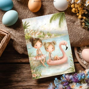 May include: A greeting card featuring two cartoon girls near a body of water. One girl sits on a stone wall, and the other floats on a pink flamingo pool float. The background shows a coastal town with palm trees and a blue sky.