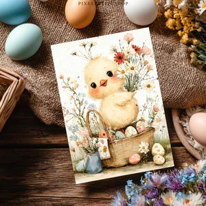 May include: An Easter-themed greeting card featuring a watercolor illustration of a yellow chick holding a basket filled with decorated eggs and flowers. The card is surrounded by painted eggs and floral arrangements.