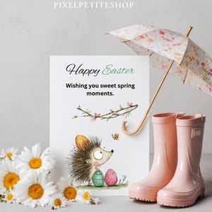 Pode incluir: Um cart&atilde;o de P&aacute;scoa com uma ilustra&ccedil;&atilde;o de ouri&ccedil;o, margaridas, botas de chuva rosa e um guarda-chuva floral. O cart&atilde;o diz "Feliz P&aacute;scoa" e "Wishing you sweet spring moments."