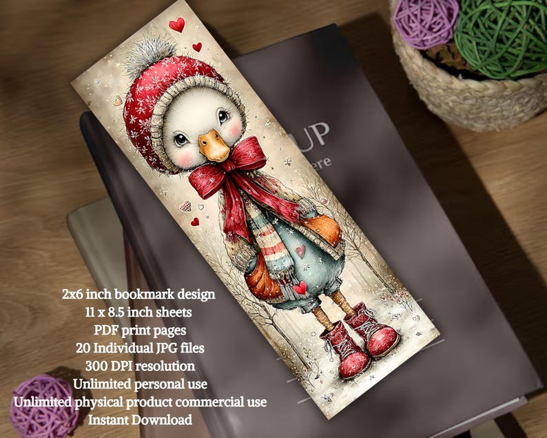 May include: A whimsical bookmark design featuring a cartoon goose in a winter outfit. The goose wears a red hat, scarf, and boots, with a bow and heart accents. The bookmark is 2x6 inches and includes text about the design and usage.