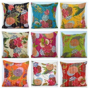 May include: Nine square throw pillows with colorful floral patterns. The pillows feature a variety of colors, including black, blue, yellow, cream, pink, green, orange, white, and red. Each pillow has a unique design with flowers and other shapes.