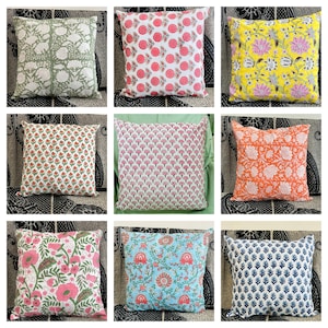 May include: Nine different patterned throw pillow covers. The patterns include floral, geometric, and paisley designs. The colours include green, pink, yellow, orange, blue, and white.