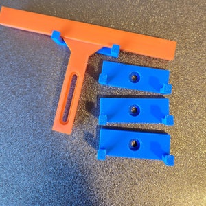 Wall Hangers for Adjustable Focusing Tools