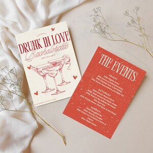 Puede incluir: Una invitación roja y blanca para una despedida de soltera con el texto "Drunk in Love Bachelorette April 26th-28th". La invitación presenta un dibujo de dos copas de martini con aceitunas y una rodaja de limón.