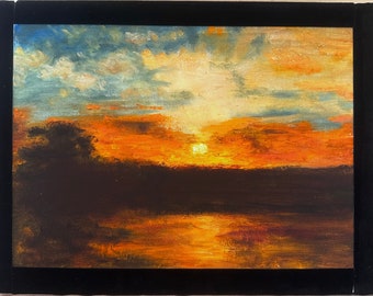 May include: A painting of a sunset over a lake with a dark silhouette of trees in the foreground. The sky is a mix of orange, yellow, and blue with fluffy white clouds. The sun is setting in the distance, casting a golden glow on the water.