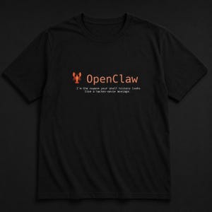 May include: Black t-shirt with the text "OpenClaw" in orange, accompanied by a lobster graphic. Below the text is the phrase, "I'm the reason your shell history looks like a hacker-movie montage."